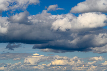 A Dynamic Sky Displaying Both White and Dark Clouds Observed Above the Earths Surface