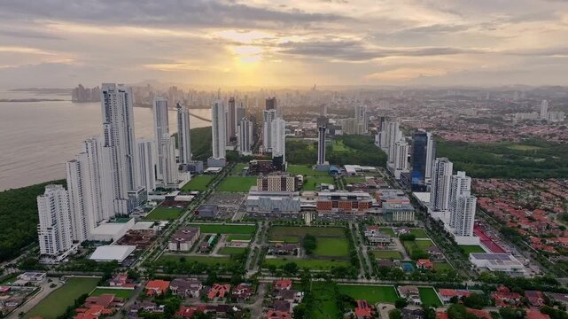 Aerial drone shot of Panama Costa del Este with the main city and a sunset in the background