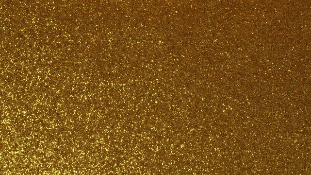 Shimmery Color Changing Yellow Gold Background with a Glitter Pattern Texture of a 4K Video Stock Footage