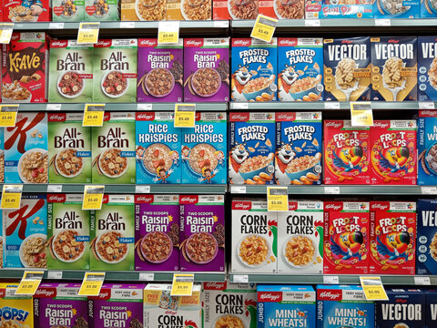 British Columbia, Canada - September 12, 2025: Store aisle in IGA supermarket shows various cereal packaging in boxes. Sale prices are displayed on items for customers.