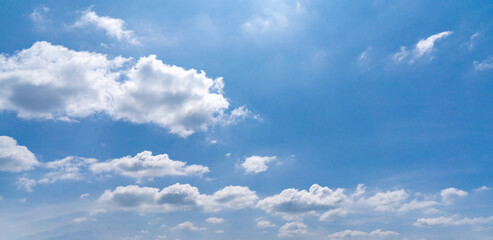 Clouds in the blue sky, Panoramic stage by light background during the summer day.