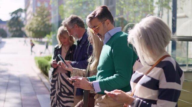 Seniors using their mobile phones outdoors