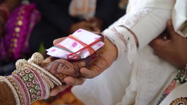 Authentic scene of a traditional Indian marriage vidhi, capturing sacred rituals performed around the holy fire (Agni) under a decorated mandap