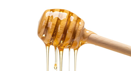 Golden honey dripping from dipper