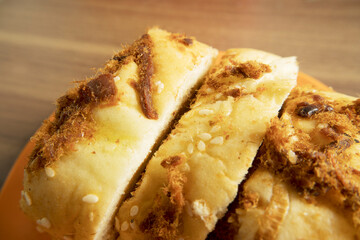 closeup sweet Bread with Sesame and Fluffy Meat Topping