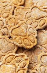 Homemade paw print dog treats close up pile