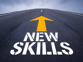 New skills concept on an asphalt road with an upward arrow pointing to the future