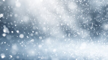 Fototapeta premium Soft snowy winter background with falling snow particles, cool white tones, minimal clean holiday aesthetic