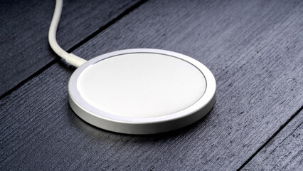 Wireless charging for smartphone on black table