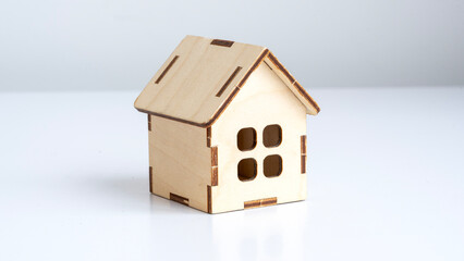Model of a wooden house on the table. real estate and construction concept