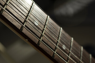 This is a close-up of the strings of an acoustic guitar.