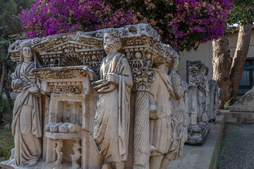 An ancient bas-relief on a marble surface. Antique carvings depicting fabulous creatures. the surface of the stone. Ancient Greek myths in marble. Ruins of an ancient city.