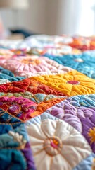 Fototapeta premium Close-up of a colorful, patterned quilt with flower-like designs on a bed
