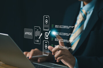 Business professional using laptop with digital approval checklist documents and check icons for quality assurance compliance workflow, data validation, audit control, and digital process management.