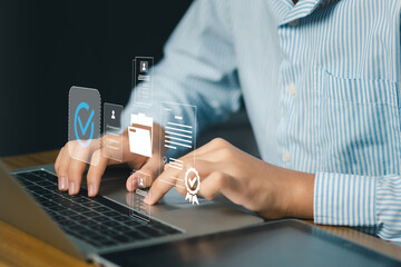 Business professional using laptop with digital verified badge, approval icons representing quality assurance, compliance, data validation, trusted service standards, performance management systems.