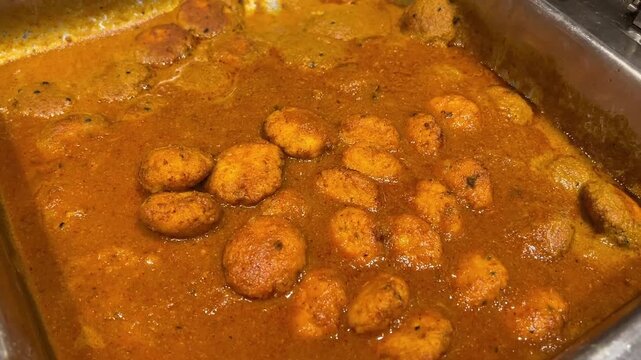 Chenna kofta curry served at a Bengali wedding in Kolkata, India.
