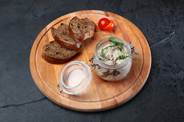 Pates in assortment are arranged in jars. Liver paste. Slices of rye bread. Healthy breakfast.Spectacular serving of dish.