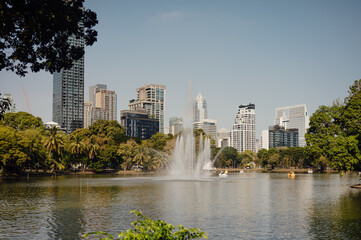 Lumpini Park Lake with Fountain and Modern Skyline, Bangkok