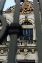 Obraz premium Junta General Building Facade Viewed Through Iron Fence, Oviedo