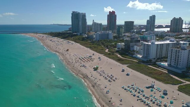 Summer in Miami from drone. Miami beach coastline. Panoramic view of Luxury condos in Miami Beach Florida. Aerial View of Surfside Miami Beach.