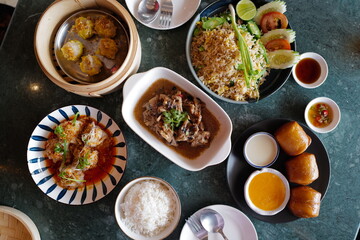 Deep fried bun served with salted egg sauce and sweet condensed milk, stir fry rice, Shumai(Chinese pork dumplings), stew ribs