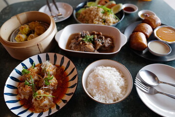 Deep fried bun served with salted egg sauce and sweet condensed milk, stir fry rice, Shumai(Chinese pork dumplings), stew ribs