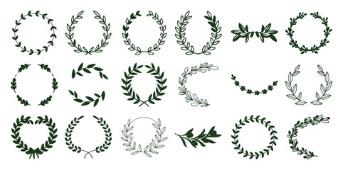 Variety of green botanical laurel wreaths and leafy branches line leaves