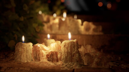 Warm candlelight illuminates a wooden staircase, casting gentle shadows. The flickering flames create a serene atmosphere, perfect for reflection and relaxation in the evening.