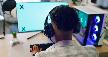 Boy, computer screen and gamer with headset for esport, competition or streaming gameplay in home....