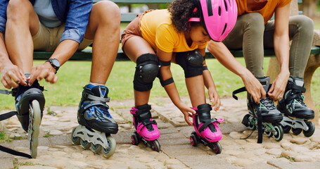 Fototapeta premium Rollerblade, parents and girl in park, family and bonding together with hobby. Outdoor, mother or father with daughter, skates or safety with active fun, tying laces or straps with support or helmet