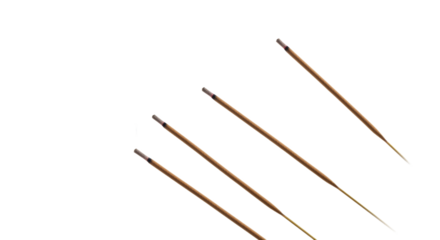 Four incense sticks release wisps of fragrant smoke in a minimalist, calming composition to create a peaceful ambiance