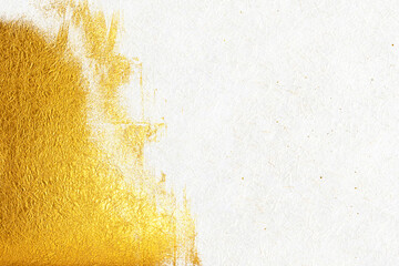 A luxurious background featuring gold patterns on white washi paper