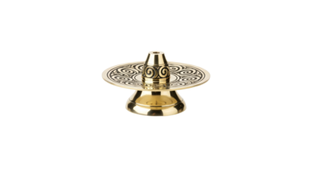Detailed shot of a decorative golden incense holder with intricate swirl pattern detailing stands prominently on a pure white backdrop in a studio