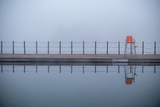 Foggy Poolside with Lifeguard Chair Reflection