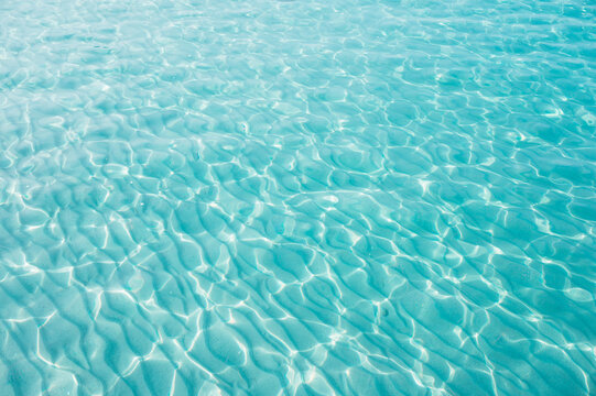 Ripples in shallow turquoise water at Klong Chao Beach, Koh Kood