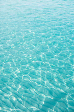 Ripples in shallow turquoise water at Klong Chao Beach, Koh Kood