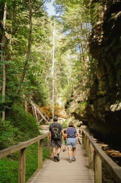 Retired couple hiking wooden trail at Turkey Run State Park