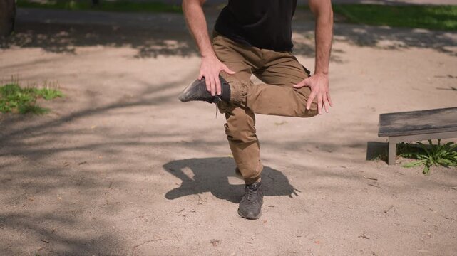 Man Balancing Outdoors, Male Practicing Onelegged Stance Outside, Individual Maintaining Stability In Outdoor Environment, Man Focuses On Balancing On One Foot During Outdoor Exercise Session