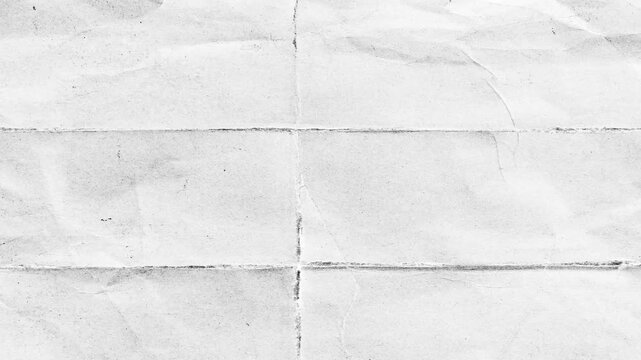White Crumpled Paper Unfolding Texture Stop Motion Animation.Stop motion animation of white crumpled paper unfolding to reveal a blank textured surface with crease lines, ideal for grunge background