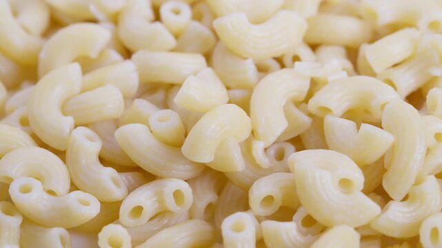 High res macaroni texture photo, Detailed macro shot of cooked durum pasta, Crystalline closeup photograph capturing intricate surface details of prepared macaroni pasta