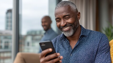 Inside a bright and inviting space, a smiling black woman texts on her smartphone, effortlessly enjoying a moment of connection with friends. The atmosphere feels warm and joyful