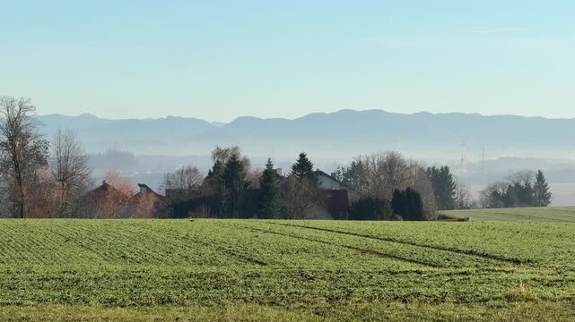 rural village with agricultural fields at alpine foothills in Upper Austria