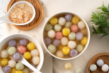 Colorful sweet glutinous rice balls tangyuan in sweet ginger syrup soup