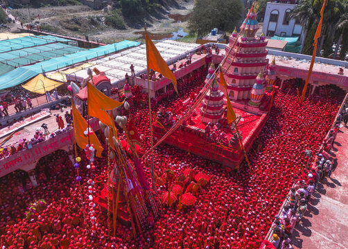 Veer, India - 05 March 2024: Aerial view of a sea of vibrant red engulfing the crowd gathered at Veer Mhaskoba Temple, Maharashtra, creating a mesmerizing spectacle.