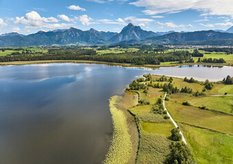 aerial photo of the alpine landscape at lake Hopfensee in the eastern Allgaeu near city of Fuessen, Bavaria, Germany 