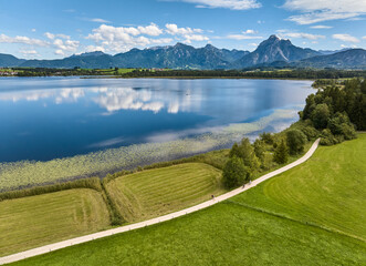 aerial photo of the alpine landscape at lake Hopfensee in the eastern Allgaeu near city of Fuessen, Bavaria, Germany 