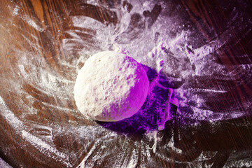 Dough ball on wooden table preparing for baking