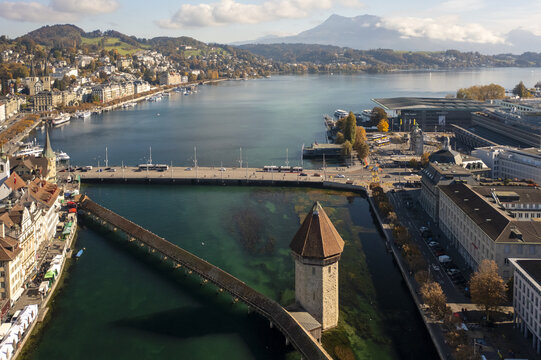Aerial view of the Chapel Bridge stretching over the Reuss River with its iconic Water Tower, a tapestry of history and nature, Lucerne, Lucerne, Switzerland.