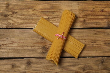 Humanitarian aid. Different food products for donation in crate on wooden table