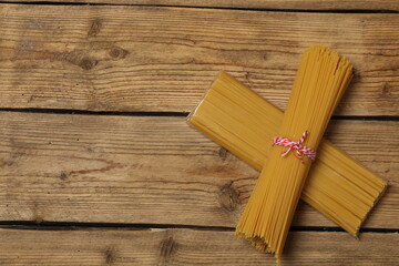 Humanitarian aid. Different food products for donation in crate on wooden table